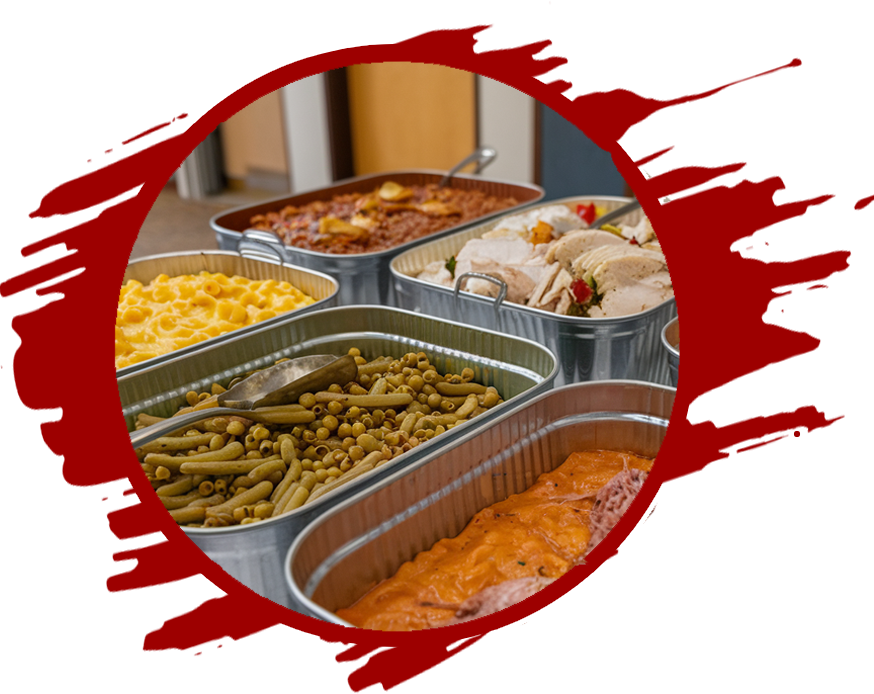 An image of a hot dog served with baked beans. The hot dog is smothered in mustard, ketchup, chopped onion, and relish