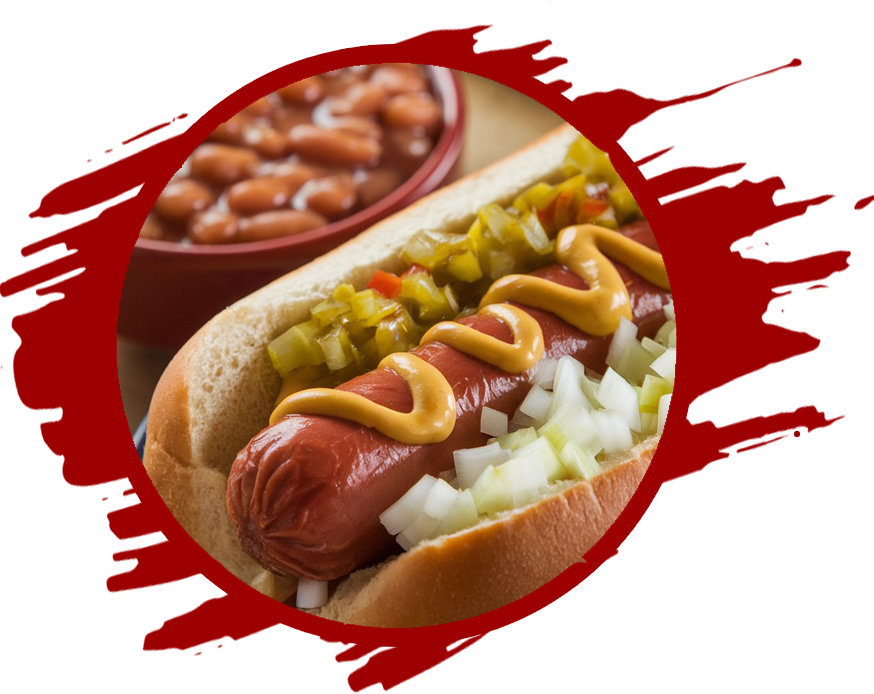 An image of a hot dog served with baked beans. The hot dog is smothered in mustard, ketchup, chopped onion, and relish